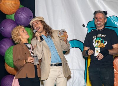 (L–R) Eden Ballou and Jordan Ballou took second place in the Boo!stillery costume contest as John Ford laughed along with the crowd.