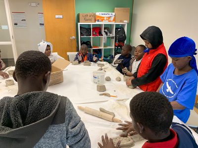 MICA organizes after-school programs where kids work on crafts with professional artists.