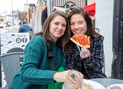 (L–R) Karisa and Mabry Williams grabbed a quick bite from Lucky Slice before they hit the booths at Craft Lake City’s Holiday Market.