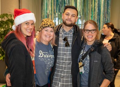 Craft Lake City Holiday Market teamsters bump into each other at the event’s entrance. It’s late in the day, but Craft Lake’s volunteers still have smiles on their faces as they prepare for load-out once the market ends