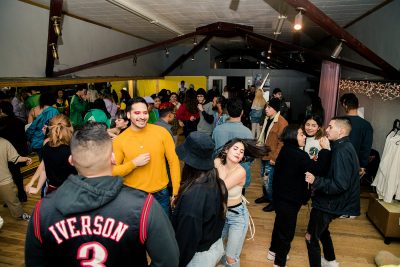 Attendees of the Existimos Open House dance the night away.