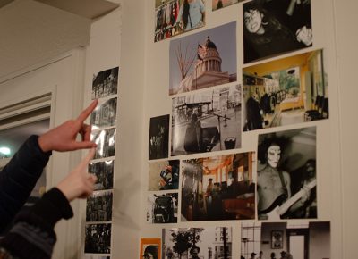 A couple admires the photos together.