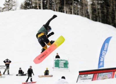 Rider does a 360 off the jump at the SLUG 20th Anniversary Meltdown Games at Brighton Resort.