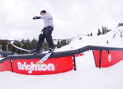 Skier on rail.