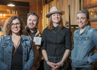 (L–R) Carinne James, Gray Thomas, Lightscatter’s Katherine Allred and Carling Mars chat as Allred keeps an eye on the door.