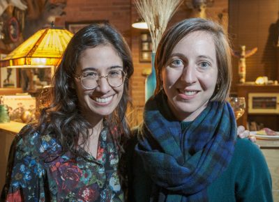 (L–R) Jaqueline Balderrama and Liza Flum catch up after Balderrama’s poetry reading.