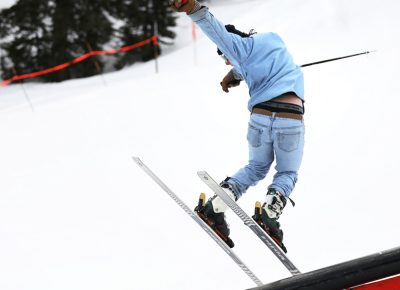 Pit Viper Sunglasses member takes to the rails and completes a sweet toe touch grind in their skis at the SLUG 20th Anniversary Meltdown Games at Brighton Resort.