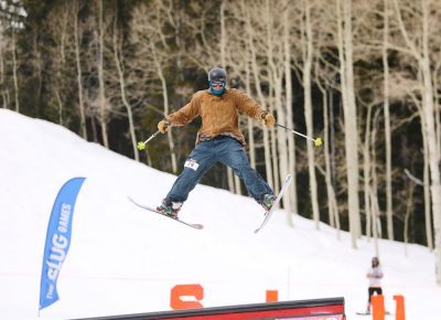 Skier goes spreadeagle off the jump at the SLUG 20th Anniversary Meltdown Games at Brighton Resort.