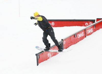 Xander Cornaby does a gentle backside grind off the rails at the SLUG 20th Anniversary Meltdown Games at Brighton Resort.