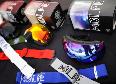 WOLFE Goggles on sale and beaming in the sun on their table at the Sponsor Village at the SLUG 20th Anniversary Meltdown Games at Brighton Resort.