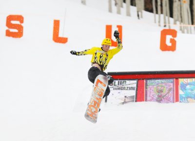 Xander Cornaby in a Flaming Yellow outfit comes in for a landing off the main jump at the SLUG 20th Anniversary Meltdown Games at Brighton Resort.