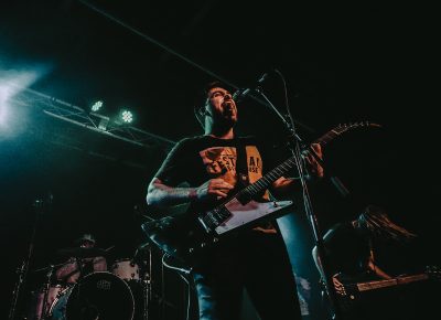 Lead vocalist of The Wildfires Projekt interacting with the crowd.