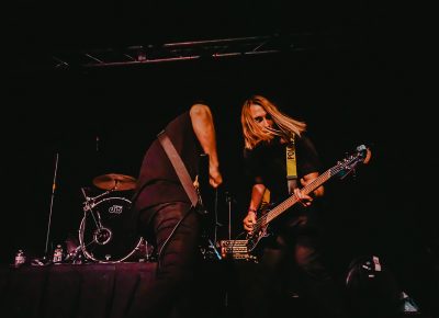 Dual shredding during a guitar-and-bass solo.