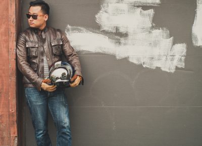 Jun Song wearing sunglasses by Twigs Woodwear and the Belstaff Brad motorcycle jacket.