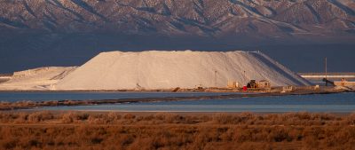 Douglas Tolman, "Inland Sea 6," 2019, from Inland Sea. Image number 5 takes a step back to conextualize the "monumental" salt piles within the wider landscape of the Bonneville basin; in the background an elongated fault-block mountain range, and the foreground a terminal saline lake. This type of landscape stretches another 500 miles west to Reno.