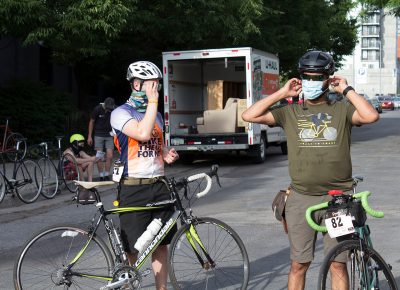 SLUG Cat riders don masks as they prepare to ride on.