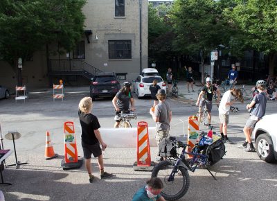 Riders gather around as the SLUG Cat festivities reach their peak.