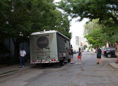 A queue of hungry SLUG Cat participants forms at the Lucky Slice truck.