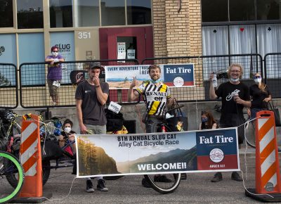 All smiles—well, sort of, as the men's category winners pose down.