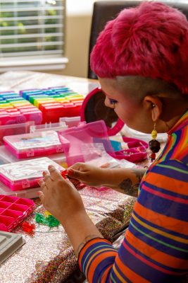 Queerations' Psy Robison hard at work on new product.