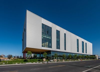 Sharp corners and soaring profiles recall the rocky cliff faces of the nearby Wasatch.