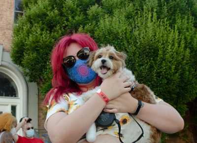 Brittany Olson with her dog Bandit enjoying the SLUG Picnic.