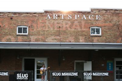 The Artspace sign stands tall over Cherry Thomas. Photo: Erin Sleater