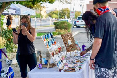 Shopper peruse the fine wares at Space Babes Art.