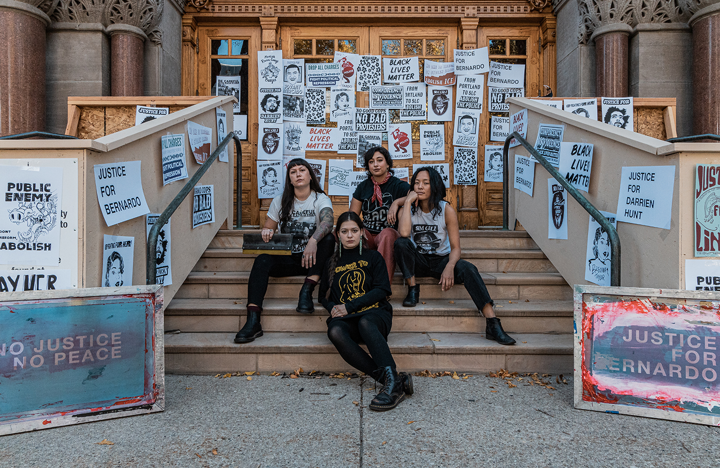 (Clockwise from left) As local propagandists Amoiri DeBusk, Taylar Jackson, Hannah Kim and Tressa Marra create and distribute screen-printed posters and T-shirts for local protest movements and abolitionist organizations.