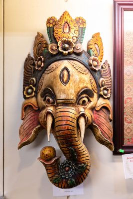 The wooden mahalaka masks available at Himalayan Arts speak to Owner Yeshi Shekhand's Tibetan heritage (3/3).