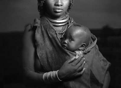 A woman from the Hamar tribe poses with her baby, near her village in southern Ethiopia, on Saturday, May 11, 2012.