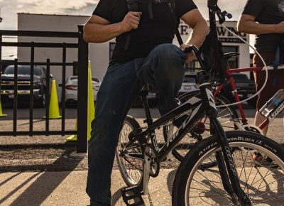 A happy racer poses for a quick pick while trying on helmets at the TF Brewing/Smith Optics checkpoint.