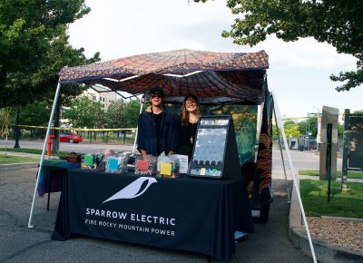 Sparrow Electric showing off their booth at the SLUG Picnic.