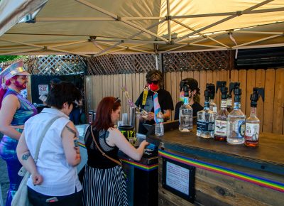 Individuals line up at the Urban Lounge patio bar to get their favorite beers, spirits and cocktails.