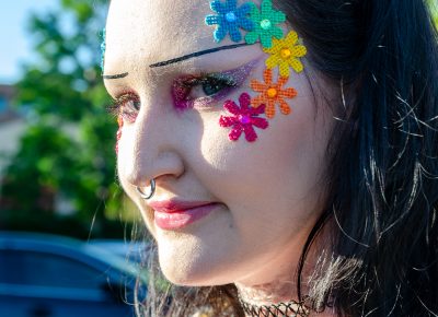 The crowd dons glitter and glam in preparation for a night of fun.