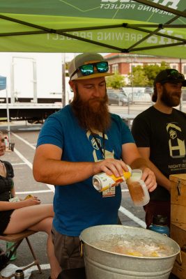 A RoHa Brewing Project team member doling out a healthy pour.