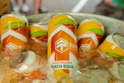 RoHa Brewing Project's refreshing Fuzzy Pucker Peach Sour floats in a bath of ice.