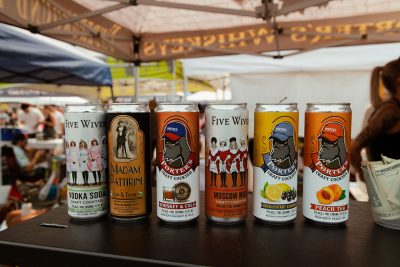 Five Wives Vodka displays their new line of canned cocktails.