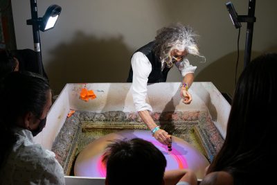 Wayne Coyne makes spin art with patrons of his immersive art experience, The King's Mouth.