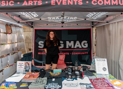 SLUG Events Coordinator Morgan Keller keeping the SLUG booth on lock.