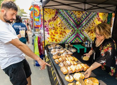 A hungry attendee looking to get their hands on some handmade goodness.