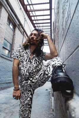 "Thankfully, I’ve learned how to embody my queerness in all aspects of my life," says Yadel Huest. "Especially in the way I dress, bold bright colors remind me that I don’t have to be afraid to put myself out there and be seen."