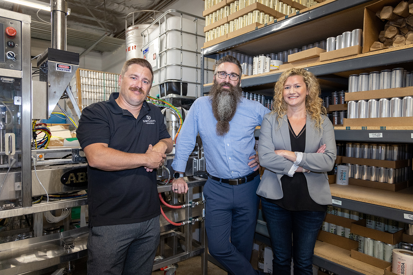 L–R: Chad Linville, Chris and Becca Weed of Simplicity Cocktails in the company’s facilities.