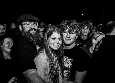 Fans posing for a photo before Rancid's set starts.