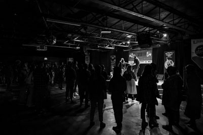 A crowd of people surrounds the stage for Bobo's set.