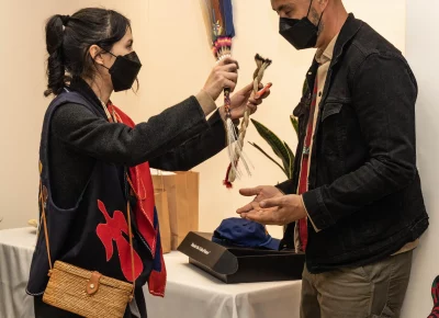 Denae Shanidiin blessing her partner Kalama Ku'ikahi Tong.