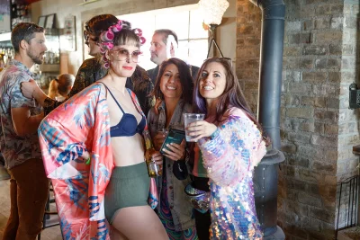 Three friends wearing fun outfits at Bunny Hop.