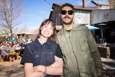 SLUG's merch team Ellie and Nick.