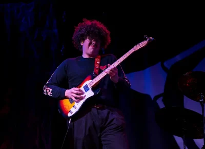 Watchers in the Blind lead guitarist plays a heavy rift for a full crowd in the Black Box section of Collide Arts Festival.