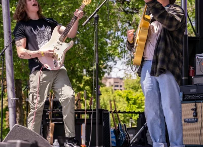 Simon Palo (left) and Simon Griffen (right) join each other while on stage, playing side by side.